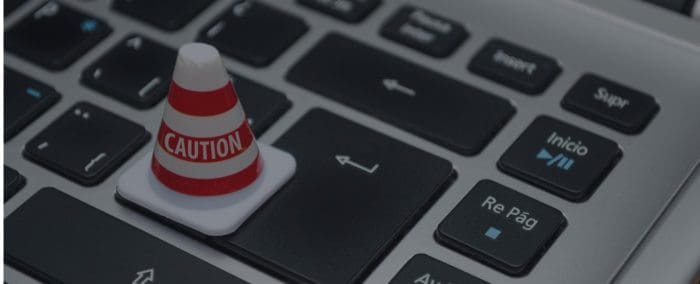 construction cone on laptop keyboard