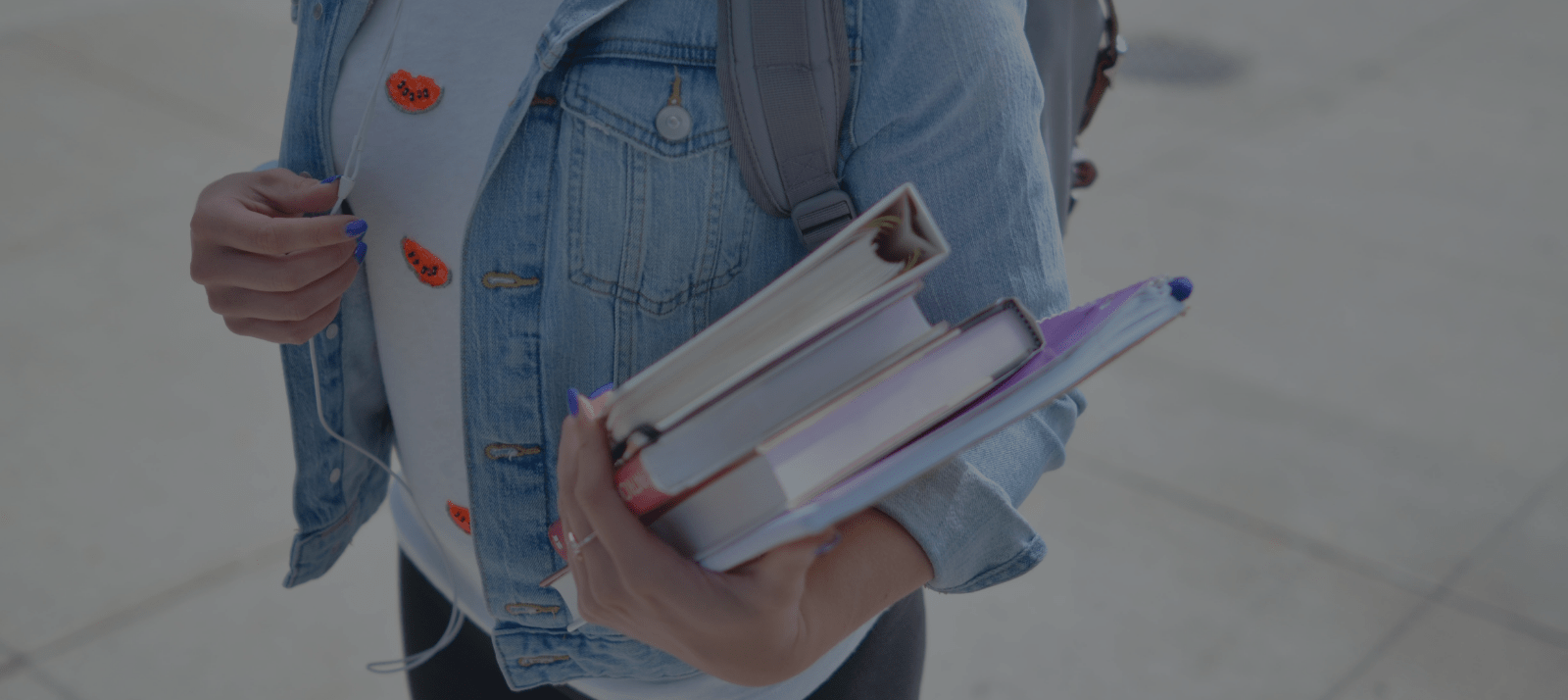 girl holding books